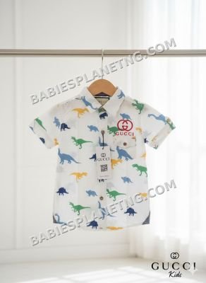 A white shirt  pattern of various dinosaur species